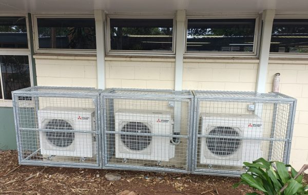 Three Fujitsu air conditioning units behind a Gold Coast commercial building